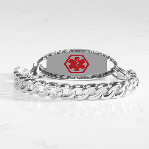 Women's silver medical ID bracelet with bright polished curb chain and interchangeable tag, displayed on marble surface.