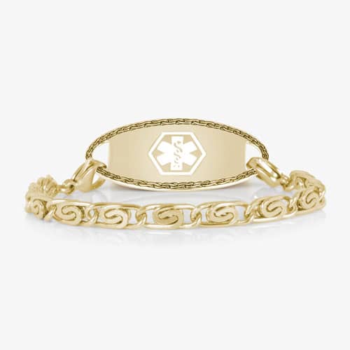 Gold medical ID bracelet with decorative swirl links and engraved medical emblem, combining elegant jewelry style with safety.