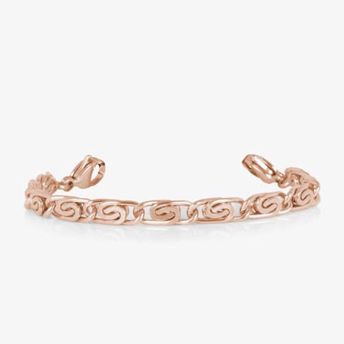 Rose gold bracelet extender with decorative swirl links and lobster clasps, designed to adjust the fit of a medical ID bracelet.