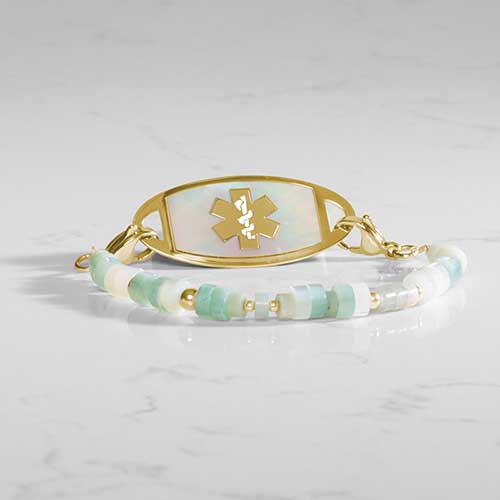Amazonite, cream and Gold beaded medical ID bracelet attached to a gold and mother of pearl medical ID tag.
