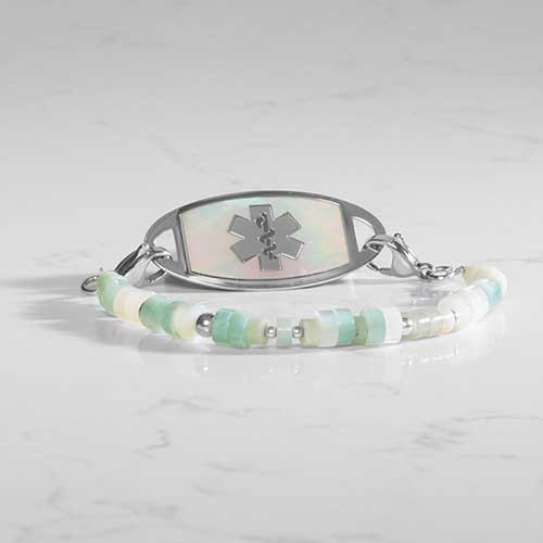 Amazonite, cream and silver beaded medical ID bracelet attached to a silver and mother of pearl medical ID tag.