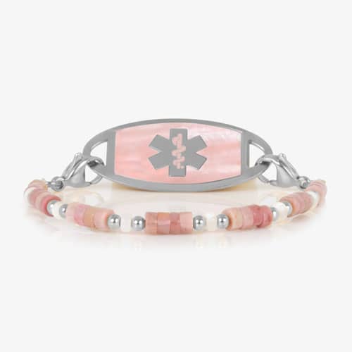 Beaded bracelet featuring Silver tone and Heishi beads in cream and rose on a stretch bracelet, attached to a Silver tone medical ID with a Silver tone medical ID tag with Pink Mother of Pearl id and Silver tone caduceus medical symbol. 