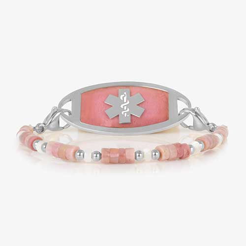 Beaded bracelet featuring Silver tone and Heishi beads in cream and rose on a stretch bracelet, attached to a Silver tone medical ID with a Silver tone medical ID tag with inlaid pink stone and Silver tone caduceus medical symbol. 