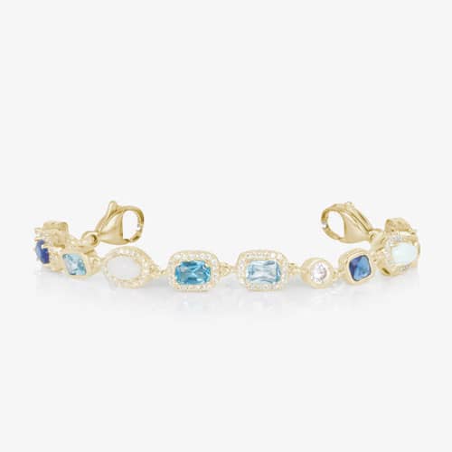 Gold bracelet extender with blue gemstone and pearl accents, designed to customize the fit of an elegant medical ID bracelet.