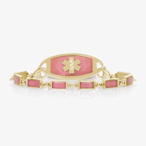 Gold-tone medical ID bracelet with rectangular pink accents and a matching pink tag featuring the medical symbol.