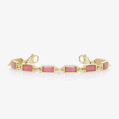 Gold-tone bracelet with rectangular pink accents, linked design, and lobster clasps.