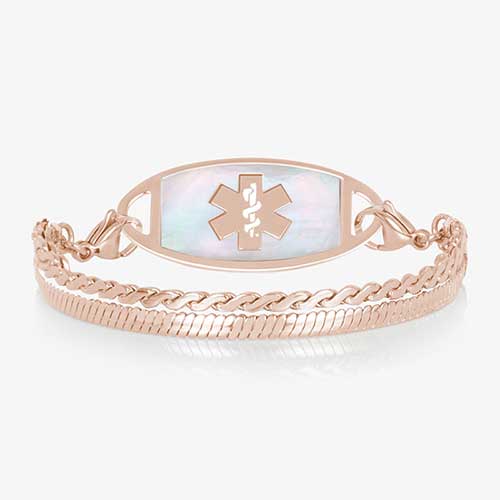 Rose gold medical ID bracelet with mother of pearl inlay tag and layered chain links on white background.