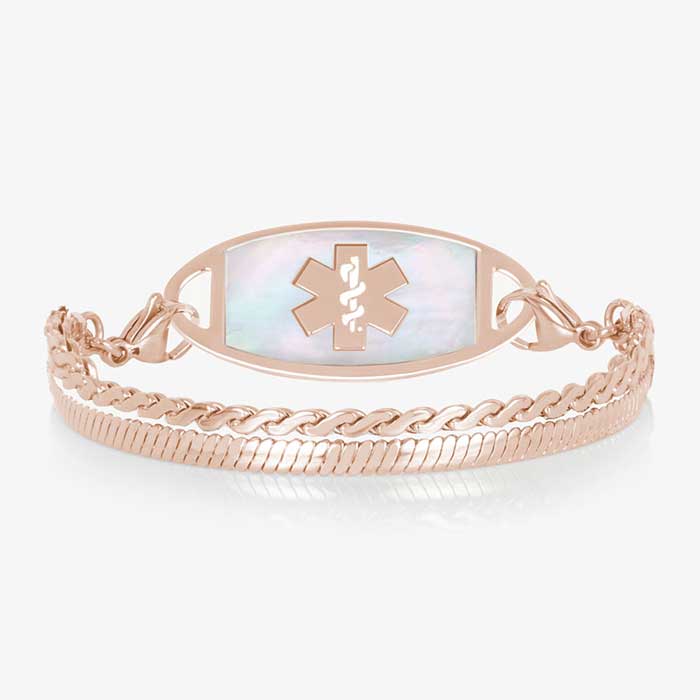 Rose gold medical ID bracelet with mother of pearl inlay tag and layered chain links on white background.