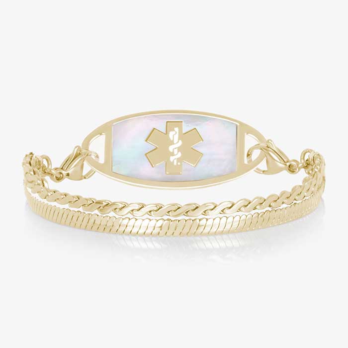 Gold medical ID bracelet with iridescent mother of pearl inlay tag and layered chain links on white background.