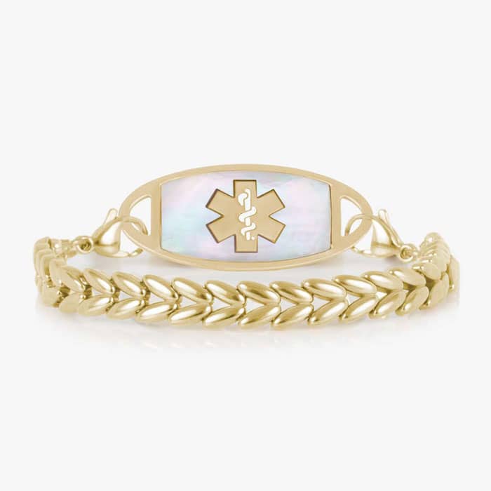 Gold-tone chevron link medical ID bracelet featuring a polished gold-tone ID tag with a Gold Star of Life symbol, and a Mother of Pearl ID tag..