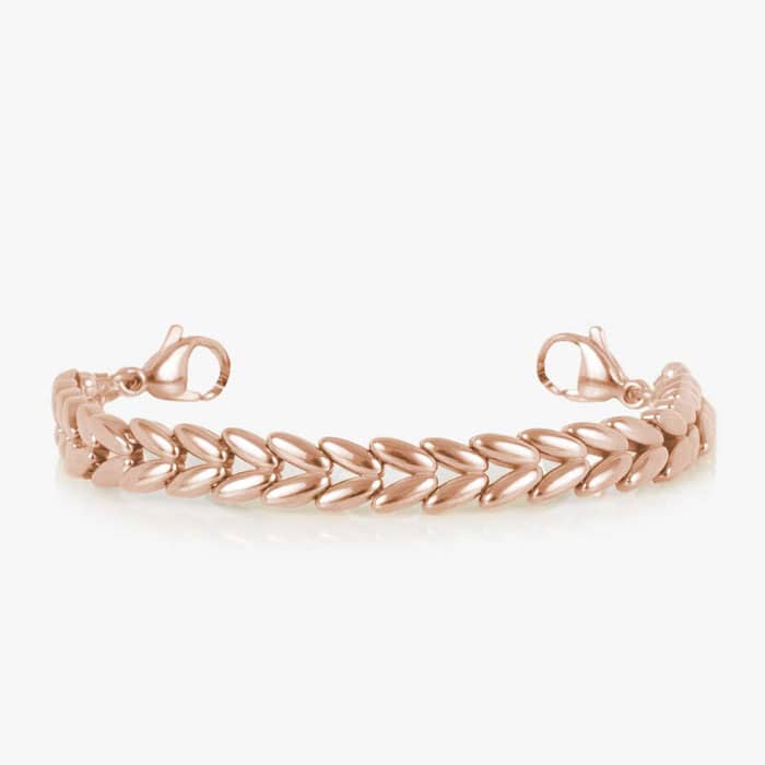 Rose gold-tone chevron link medical ID bracelet with a white mother-of-pearl inlay tag featuring the Star of Life symbol.