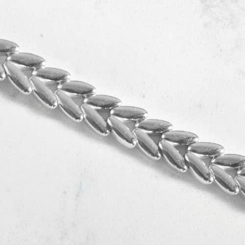 Close-up of the silver tone chevron link bracelet.