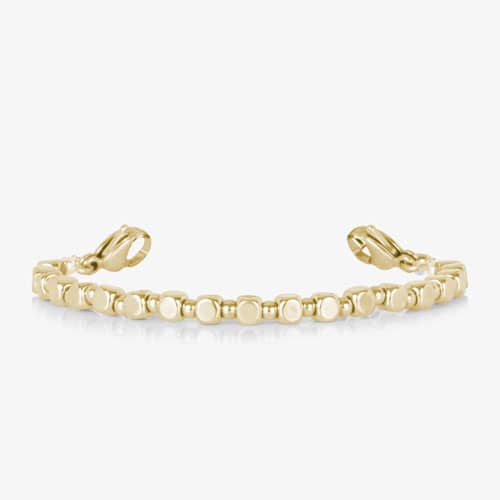 Facet Gold interchangeable bracelet featuring polished gold-tone faceted links with lobster clasps and a sleek, modern design.
