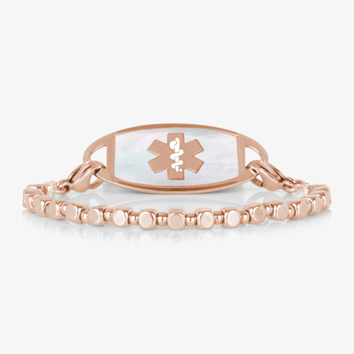 Front view of the Facet Rose interchangeable bracelet paired with a rose gold-tone medical ID tag featuring a white mother-of-pearl inlay.