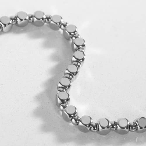 Close-up of the Facet Silver interchangeable bracelet featuring polished silver-tone faceted links with a sleek, minimalist design.