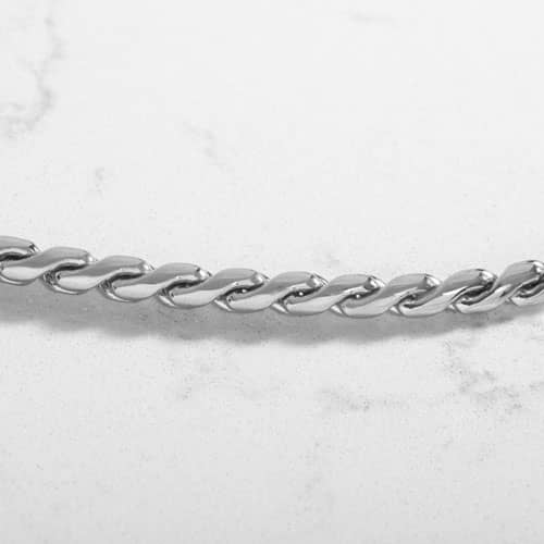Close-up of the Faron Silver interchangeable bracelet featuring polished silver-tone curb links with a classic chain design.