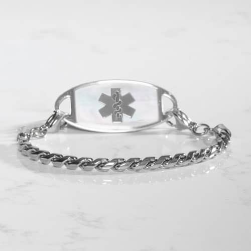 Angled view of the Faron Silver bracelet paired with a silver-tone medical ID tag featuring a white mother-of-pearl inlay.