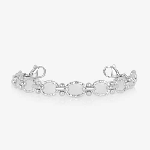 Silver-tone Iris interchangeable bracelet featuring textured oval links, polished bead accents, and lobster clasps for a timeless look.