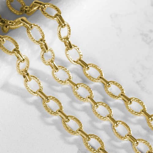 Close-up of the Ivy gold-tone medical ID bracelet showcasing textured oval links and polished finishes for a timeless look.