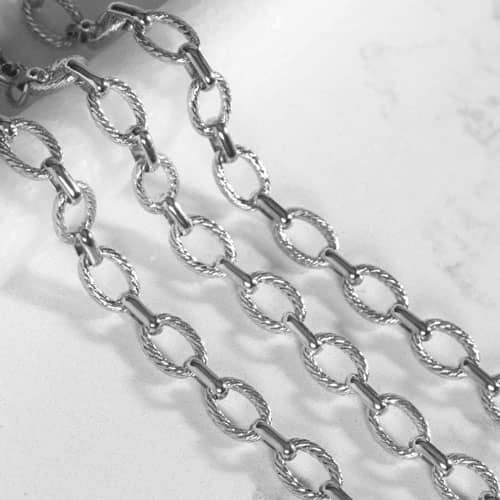 Close-up of the Ivy bracelet's textured silver oval chain links, highlighting the polished finish and interchangeable design.