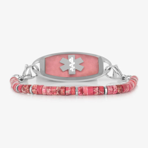 Silver-tone medical ID bracelet with pink jasper heishi beads, silver spacer accents, and a pink stone inlay ID tag featuring the Star of Life symbol.