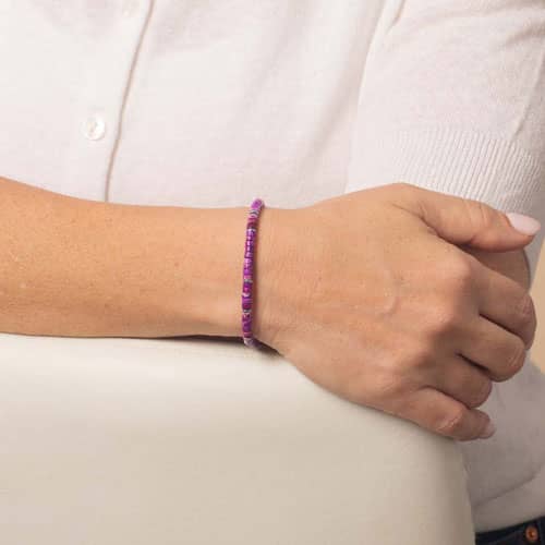 Purple heishi bead medical ID bracelet worn as a minimalist beaded bracelet on the wrist.