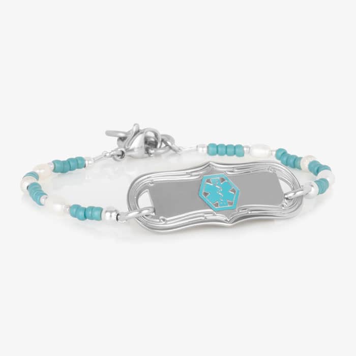 Silver-tone medical ID bracelet with turquoise and white seed beads, silver accent beads, and a decorative ID tag featuring a turquoise medical symbol.