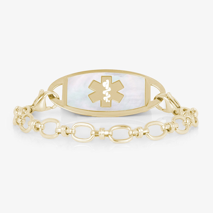 Gold-tone medical ID bracelet with oval-link chain and a white inlay ID tag featuring the medical symbol.