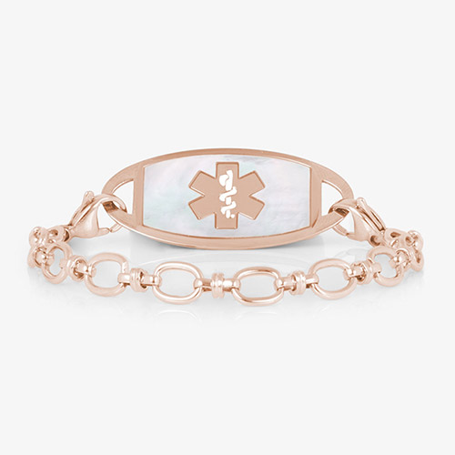 Rose gold-tone medical ID bracelet with oval-link chain and white inlay tag featuring the medical symbol.