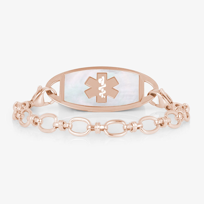 Rose gold-tone medical ID bracelet with oval-link chain and white inlay tag featuring the medical symbol.