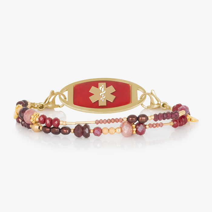 Ruby, garnet, and pink crystal and beaded multi-strand medical ID bracelet paired with gold tone stainless steel medical ID tag with crimson red inlay and gold medical symbol at the center.