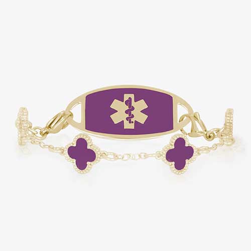 12k gold plate clover shaped medical ID bracelet with berry inlay paired with gold tone stainless steel medical alert tag with lilac abalone inlay.