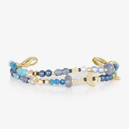 Celestial-inspired bracelet strand with layered blue gemstone beads, pearl accents, and gold moon and star charms for a dreamy look.