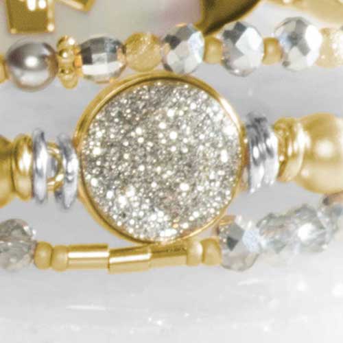 Alternate flat lay of silver and gold beaded medical ID bracelet with lobster clasp and engraved ID tag.