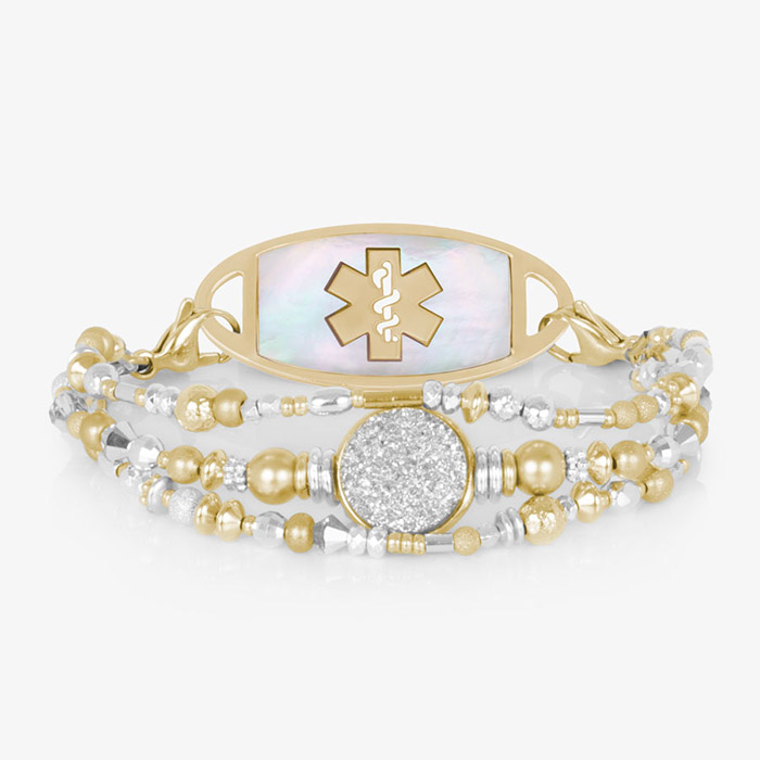 Mother-of-pearl medical ID tag with gold medical symbol, attached to dual-tone beaded bracelet.