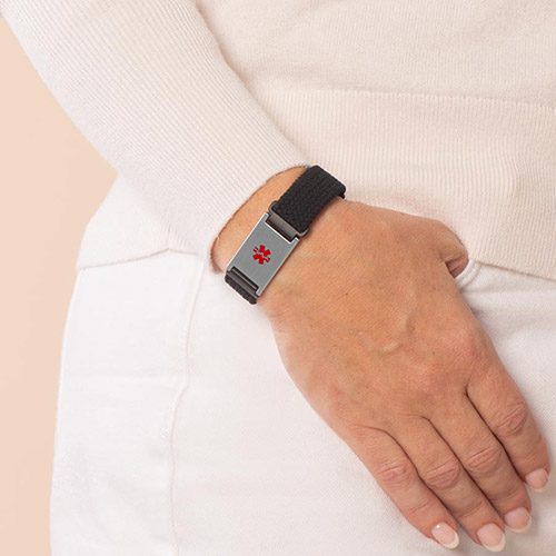Urban Stretch Medical ID Bracelet in Black and Silver, shown on wrist, featuring a red medical caduceus symbol for clear medical identification