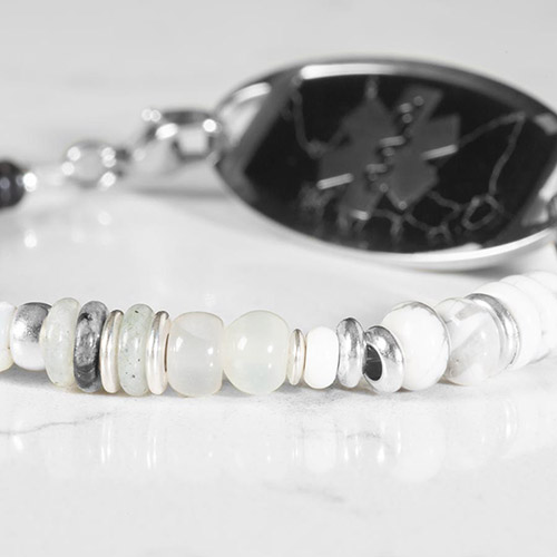 Donna Stretch Beaded Medical ID Bracelet, shown on wrist, blending casual charm and glam with a black cubic zirconia centerpiece and interchangeable medical ID tag