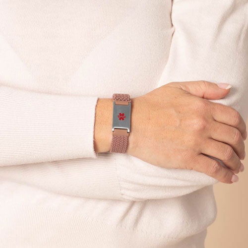 Urban Stretch Medical ID Bracelet in Rosewood and Silver, shown on wrist, featuring a red medical caduceus symbol for clear medical identification