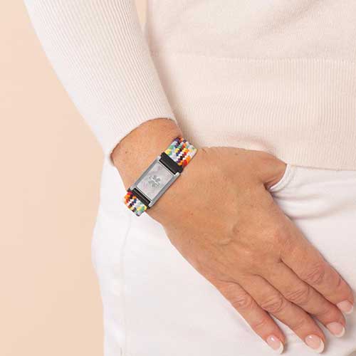 Urban Stretch Medical Alert Bracelet in Rainbow and Silver, shown on wrist for daily wear, featuring a Mother of Pearl inlay