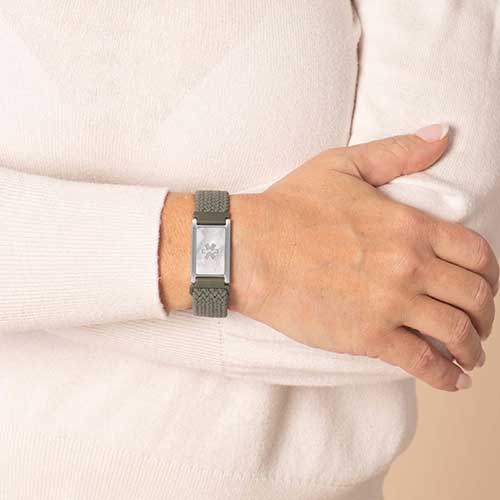 Urban Stretch Medical ID Bracelet in Green and Silver with Mother of Pearl inlay, shown on wrist, featuring a silver medical caduceus symbol for clear medical identification