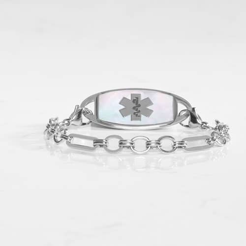Classic silver tone chain in alternating link sizes and shapes which attaches to a tag using the 2 lobster clasps, displayed with a medical ID tag with a silver tone medical symbol, and Mother of Pearl inlay.