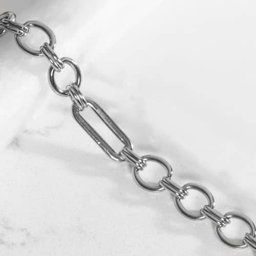 Classic silver tone chain in alternating link sizes and shapes which attaches to a tag using the 2 lobster clasps,