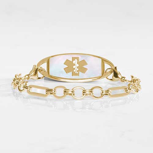 Classic Gold tone chain in alternating link sizes and shapes which attaches to a tag using the 2 lobster clasps, displayed with a medical ID tag with a gold tone medical symbol, and Mother of Pearl inlay.