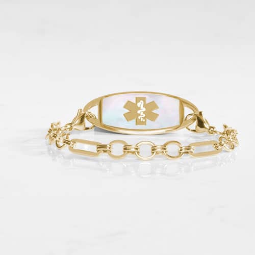 Classic Gold tone chain in alternating link sizes and shapes which attaches to a tag using the 2 lobster clasps, displayed with a medical ID tag with a gold tone medical symbol, and Mother of Pearl inlay.