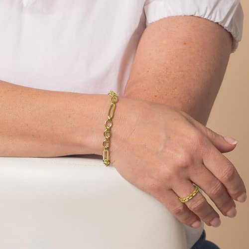 Women displaying a Classic gold tone chain in alternating link sizes and shapes which attaches to a medical ID tag using the 2 lobster clasps.
