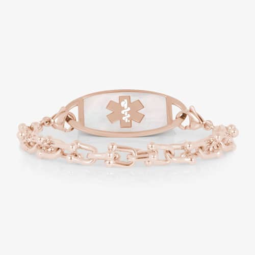 Rose gold-tone link medical ID bracelet featuring a white mother-of-pearl tag with a Star of Life symbol.