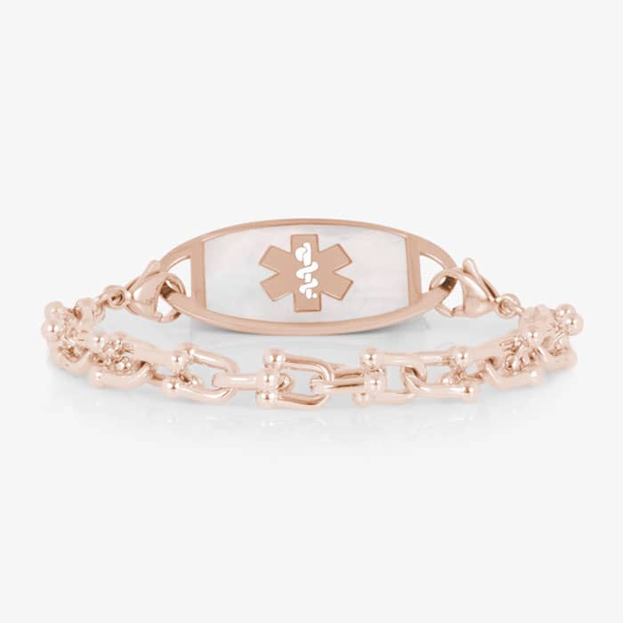 Rose gold-tone link medical ID bracelet featuring a white mother-of-pearl tag with a Star of Life symbol.