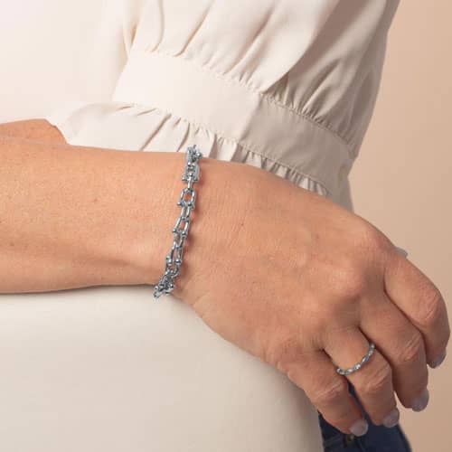 Silver-tone link medical ID bracelet worn on the wrist, showing its polished decorative link design.
