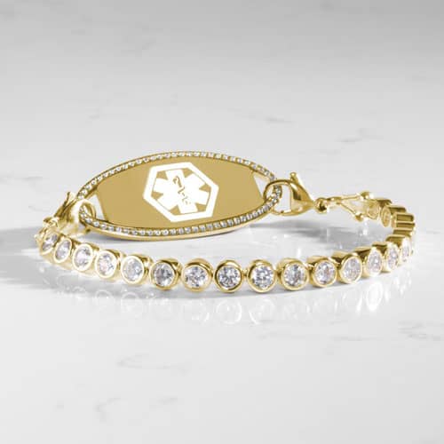 Stella Gold bracelet paired with a medical ID tag, combining sparkling clear stones with essential medical identification.
