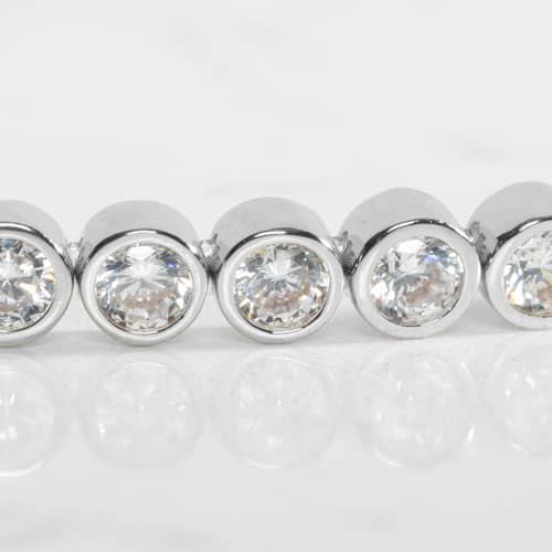 Close-up of Stella Silver bracelet detailing brilliant round clear stones in polished bezel settings for added sparkle.